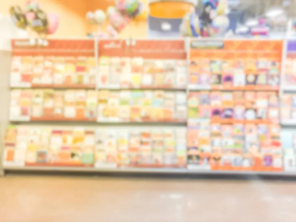 Blurry background wide selection of greeting cards display at a supermarket in USA