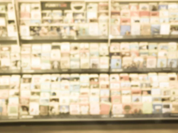 Filtered image blurry background wide selection of greeting cards display at a supermarket in USA — Stock Photo, Image