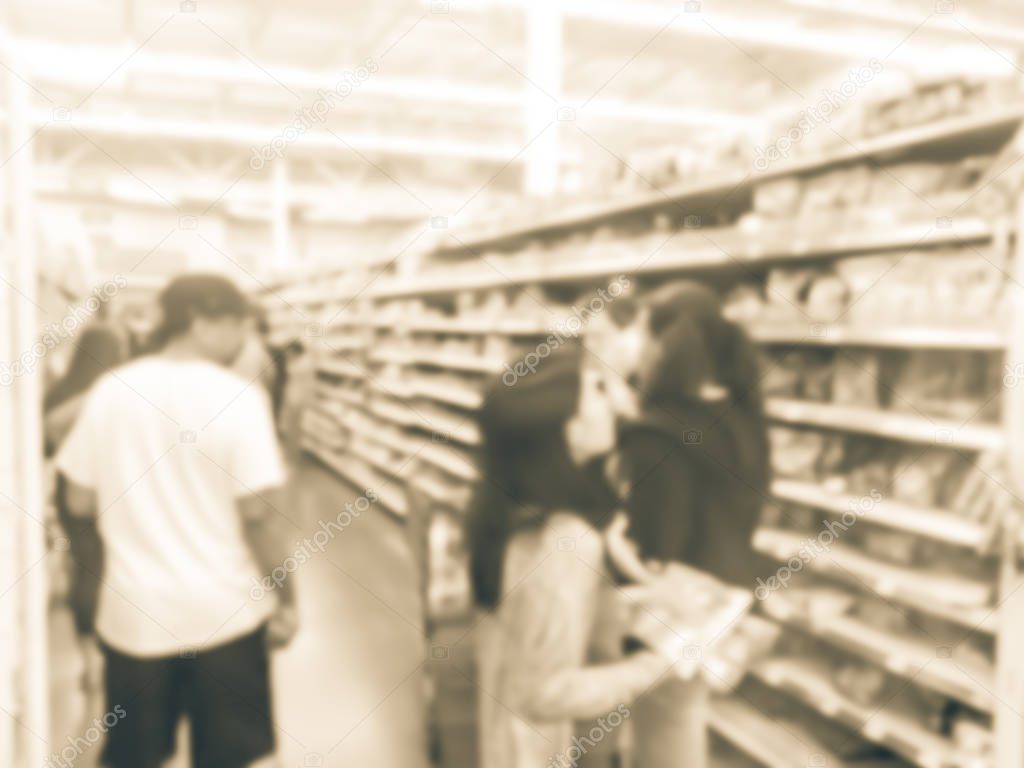 Blurry background diverse customers stock up candy at grocery stores in America