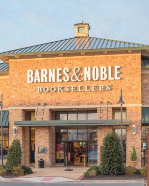 Close-up entrance to Barnes Noble chain store at sunset in Flower Mound, Texas, US