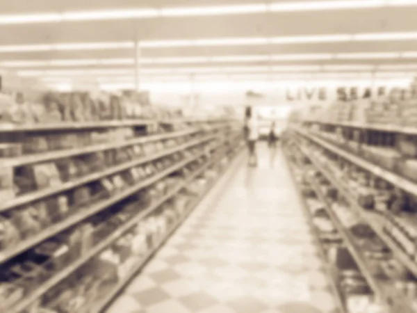 Imagem filtrada desfocada cliente de fundo compras no supermercado asiático nos EUA — Fotografia de Stock
