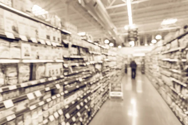 Imagem filtrada desfocada compras cliente de fundo para suprimentos de cozimento no supermercado na América — Fotografia de Stock