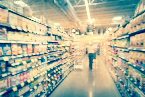 Filtered image blurry background customer shopping for baking supplies at supermarket in America — Stock Photo, Image