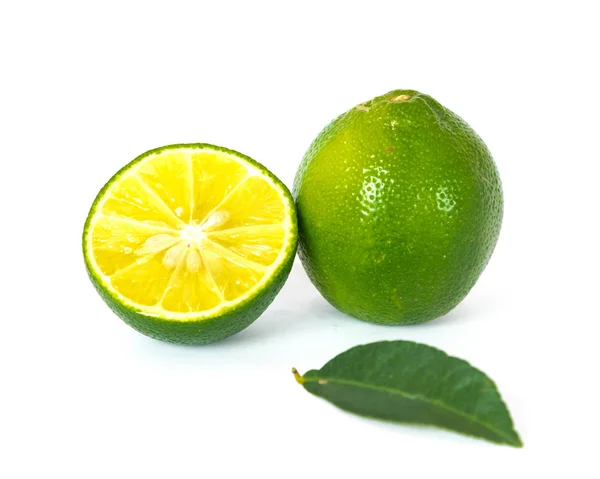 Whole and slide cut lime and leaf isolated on white — Stock Photo, Image