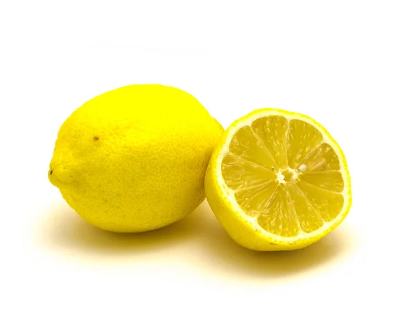 Studio shot one lemon with fresh slice cuts isolated on white — Stok fotoğraf