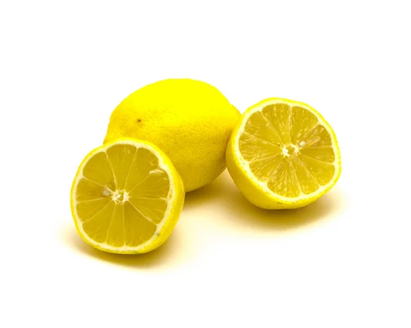 Studio shot one lemon with fresh slice cuts isolated on white — Stok fotoğraf