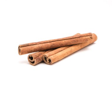 Studio shot three cinnamon stick barks isolated on white