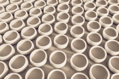 Filtered image group of raw unbaked clay terra cotta pots full background in Hanoi, Vietnam