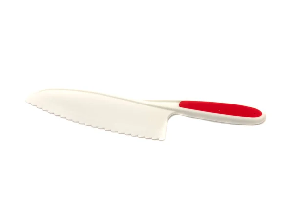 Estúdio tiro faca de plástico com lâmina serrilhada isolado em branco — Fotografia de Stock