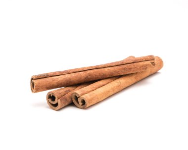 Studio shot three cinnamon stick barks isolated on white