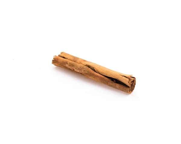 Studio shot one raw dried organic cinnamon stick isolated on white — ストック写真