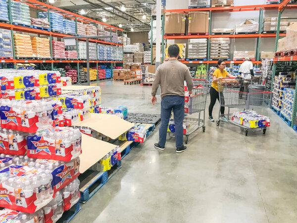 LEWISVILLE, TX, US-FEB 3, 2020: Shoppers stocking bottled water at Costcow Warehouse store. Coronavirus Covid-19 or Wuhan chaos sends people into panic-buying mode