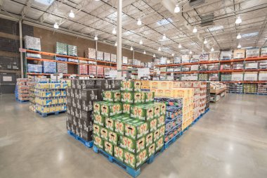 OCT 19, 2018-TEXAS, US: Imported beers on display in stack of large cardboard boxes at Costco Wholesale in Lewisville, Texas, America. Variety of beverages at supermarket.