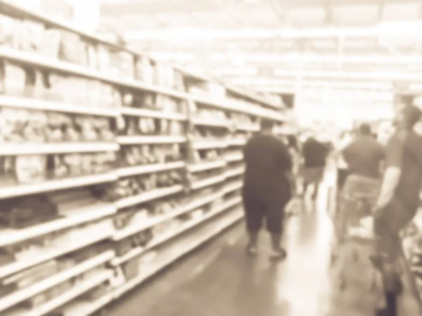 Blurry background customers with shopping cart stock up candy at grocery stores in America — Stock Photo, Image