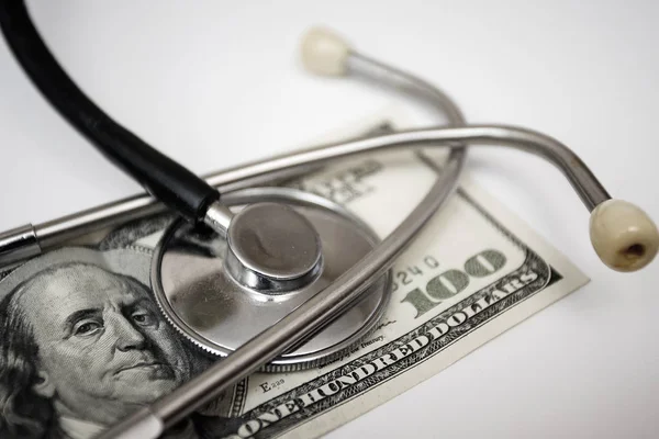Stethoscope on money - medical concept
