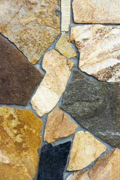 A wall of a wild multi-colored natural stone texture — Stock Photo, Image
