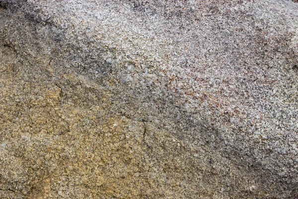 Close-up van een granieten muur van een gebouw voor achtergronden. — Stockfoto