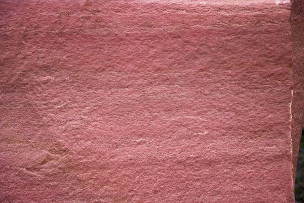 Nahaufnahme einer Granitwand eines Gebäudes für Hintergründe. — Stockfoto