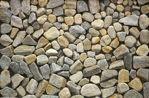 Parede enfrentando pedra de cores diferentes em estoque — Fotografia de Stock