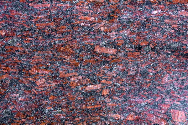 黒と灰色の斑点のある花崗岩のテクスチャ、赤ベース — ストック写真
