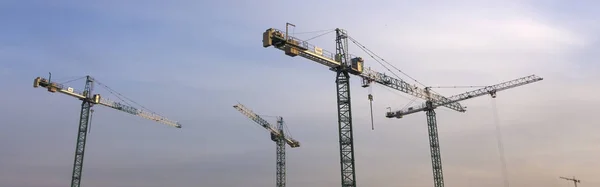 Cranes on construction site. — Stock Photo, Image