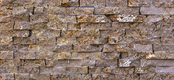 Текстура кам'яних стін, травертинова плитка, облицьована каменем — стокове фото