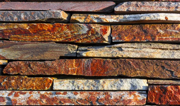 Fragment of artistic wall made with multiple stones Royalty Free Stock Photos