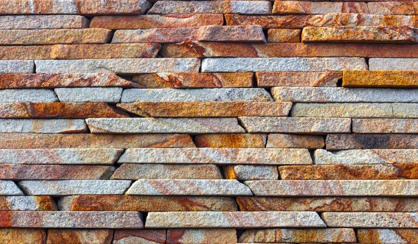 Piedra multicolor moderna, pizarra travertino arenisca pared utilizada para fondo — Foto de Stock