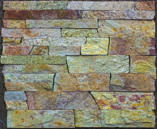Piedra multicolor moderna, pizarra travertino arenisca pared utilizada para fondo — Foto de Stock