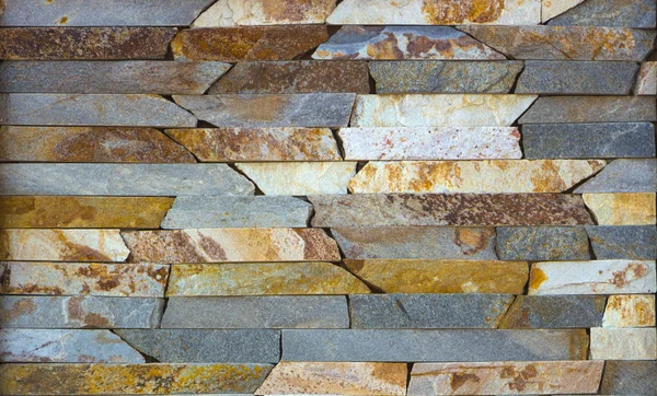 Piedra multicolor moderna, pizarra travertino arenisca pared utilizada para fondo — Foto de Stock