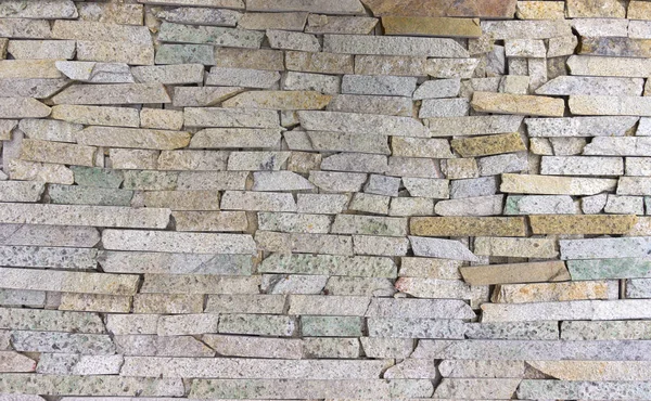 Moderní vícebarevná kamenná zeď používaná pro pozadí — Stock fotografie
