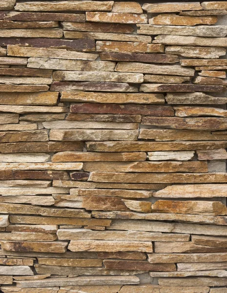 Muro de piedra multicolor moderno utilizado para fondo — Foto de Stock