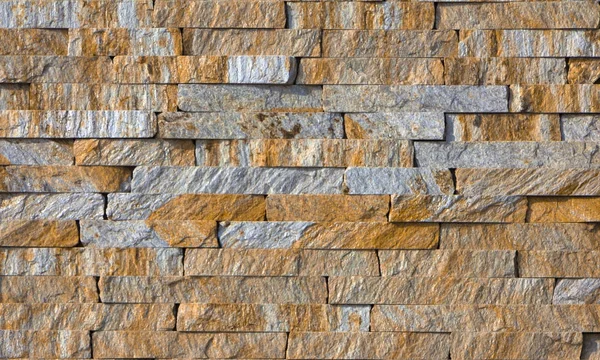 Piedra multicolor moderna, pizarra travertino arenisca pared utilizada para fondo — Foto de Stock