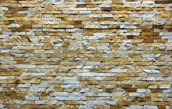 Современный разноцветный камень, стена из песчаника, используемая для фона — стоковое фото