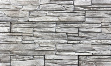 Beton döşeme arka plan veya doku olarak karşı karşıya gelen dekoratif tuğla duvar