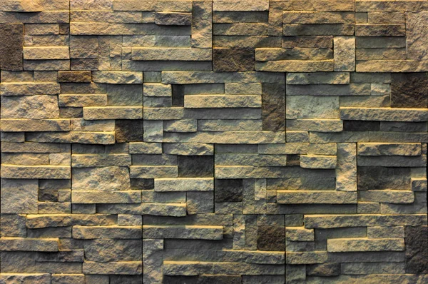 Decorative brick wall from concrete facing tiles as background or texture