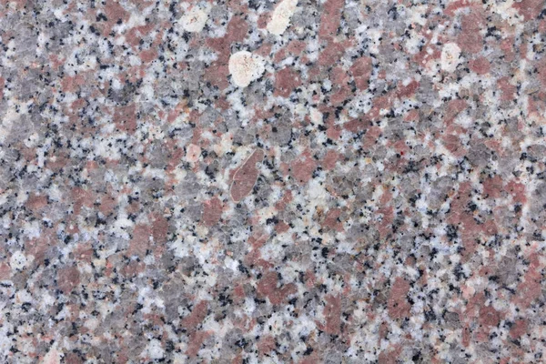 Textura de granito, Base roja con manchas negras y grises — Foto de Stock