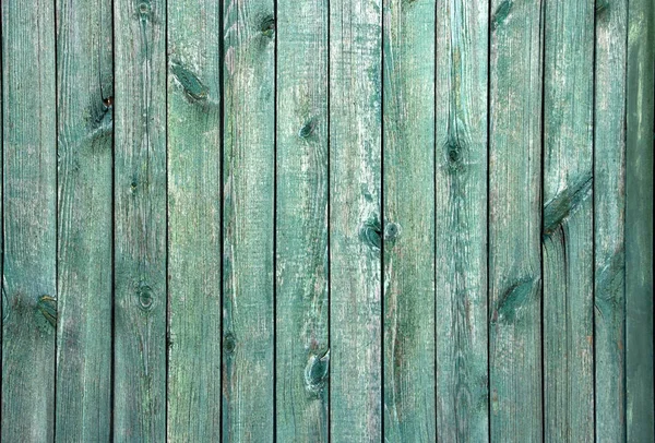 Antecedentes de velhas tábuas de madeira. Textura de madeira turquesa com tinta de descascamento — Fotografia de Stock