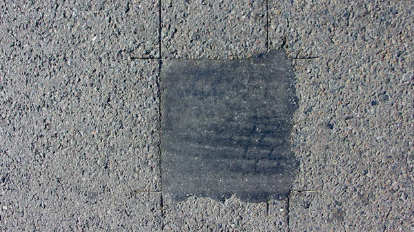 A textura do asfalto em que há rachaduras — Fotografia de Stock