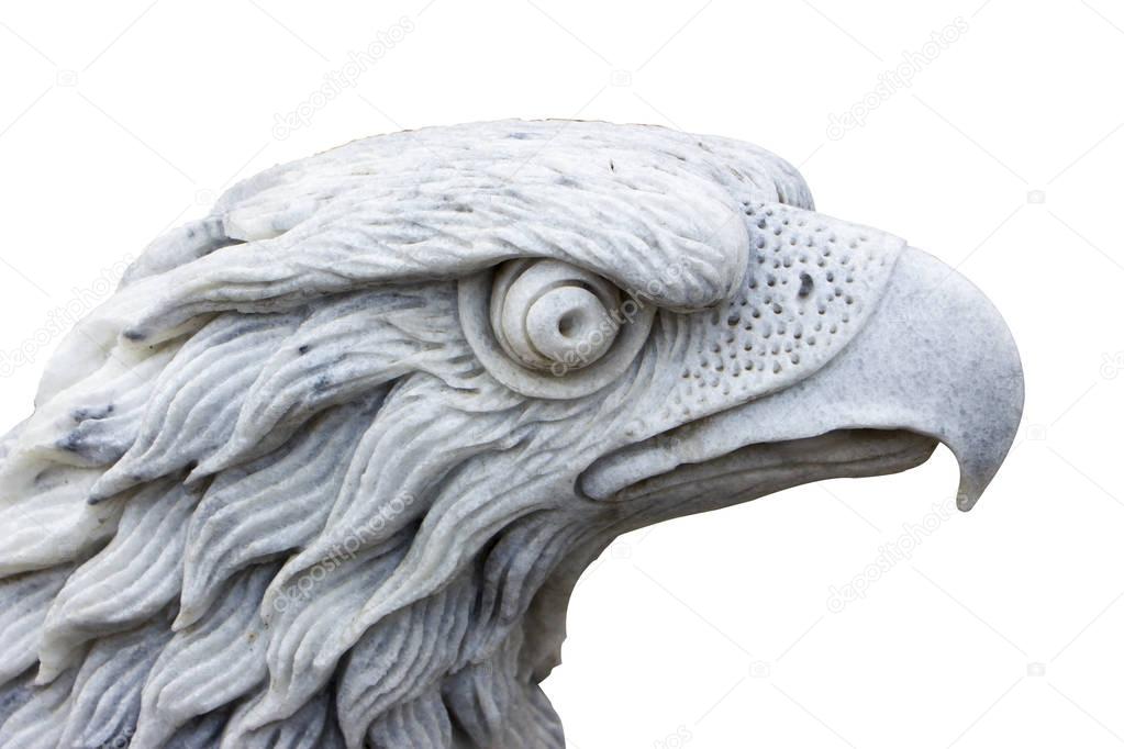 Eagle carved from white marble. Isolated on white