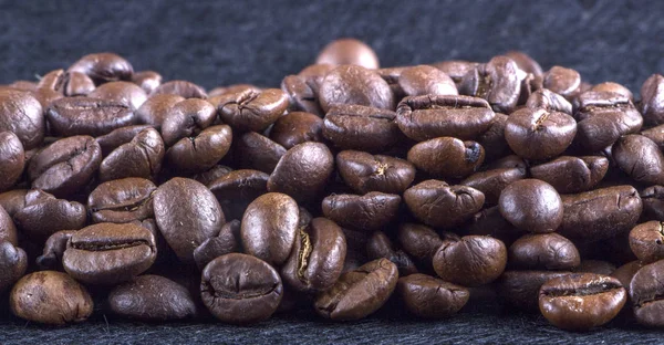 texture of coffee, with beautiful patches of light on the surface of grains