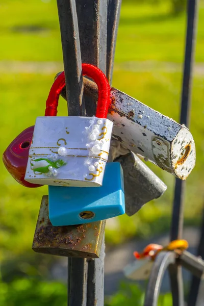 Vintage colorful padlocks heart shaped on blurred background, symbol of love — Stock Photo, Image