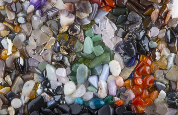 여러 가지 빛깔된 닦은 돌 배경에서 배경 — 스톡 사진