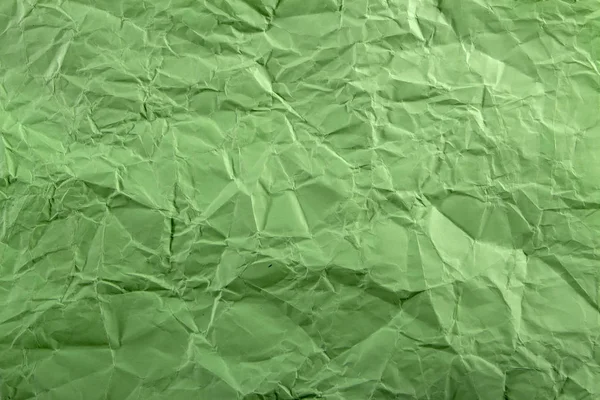 Groene crêpe gekreukt papier textuur achtergrond abstract — Stockfoto
