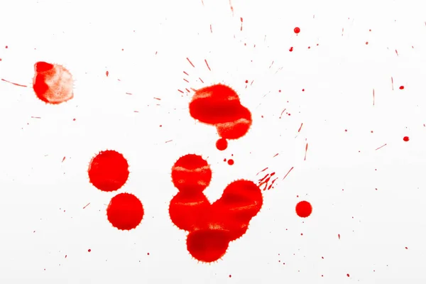 Gotas de sangre roja sobre papel blanco —  Fotos de Stock