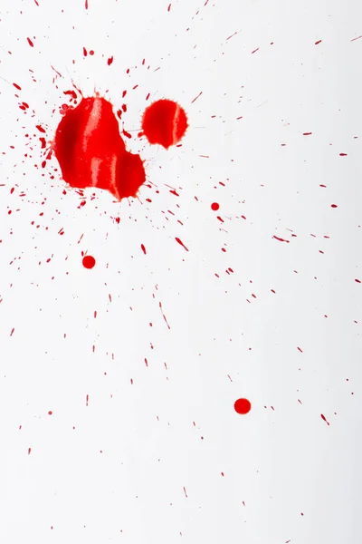 Gotas de sangre roja sobre papel blanco — Foto de Stock