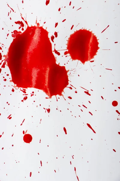 Gotas de sangre roja sobre papel blanco —  Fotos de Stock