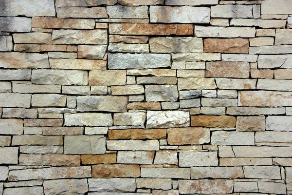Dikensiz taş duvarlı antik taş kaldırım taşları. — Stok fotoğraf