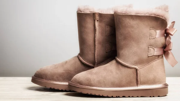 Winter brown felt boots on a white background