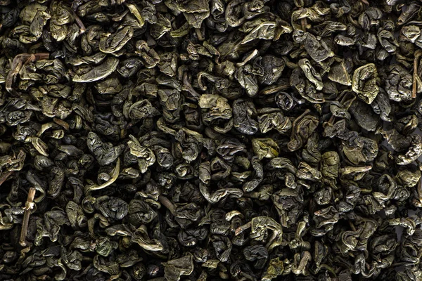 Υψηλή ποιότητα υφής αποξηραμένων φύλλων πράσινου τσαγιού. — Φωτογραφία Αρχείου